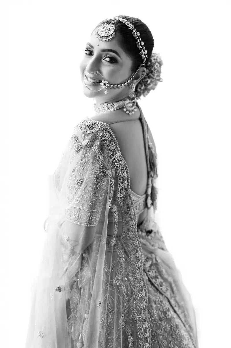 A bride in black and white, veil lifted