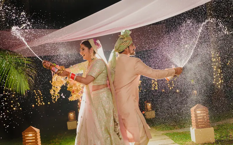 Champagne sprayed at a Goa beach wedding
